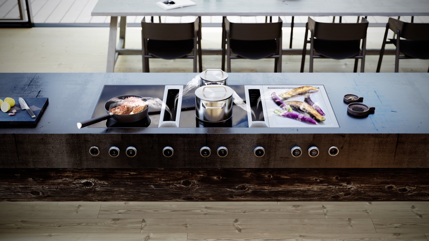 Isla de cocina con placas BORA y extracción integrada en la superficie